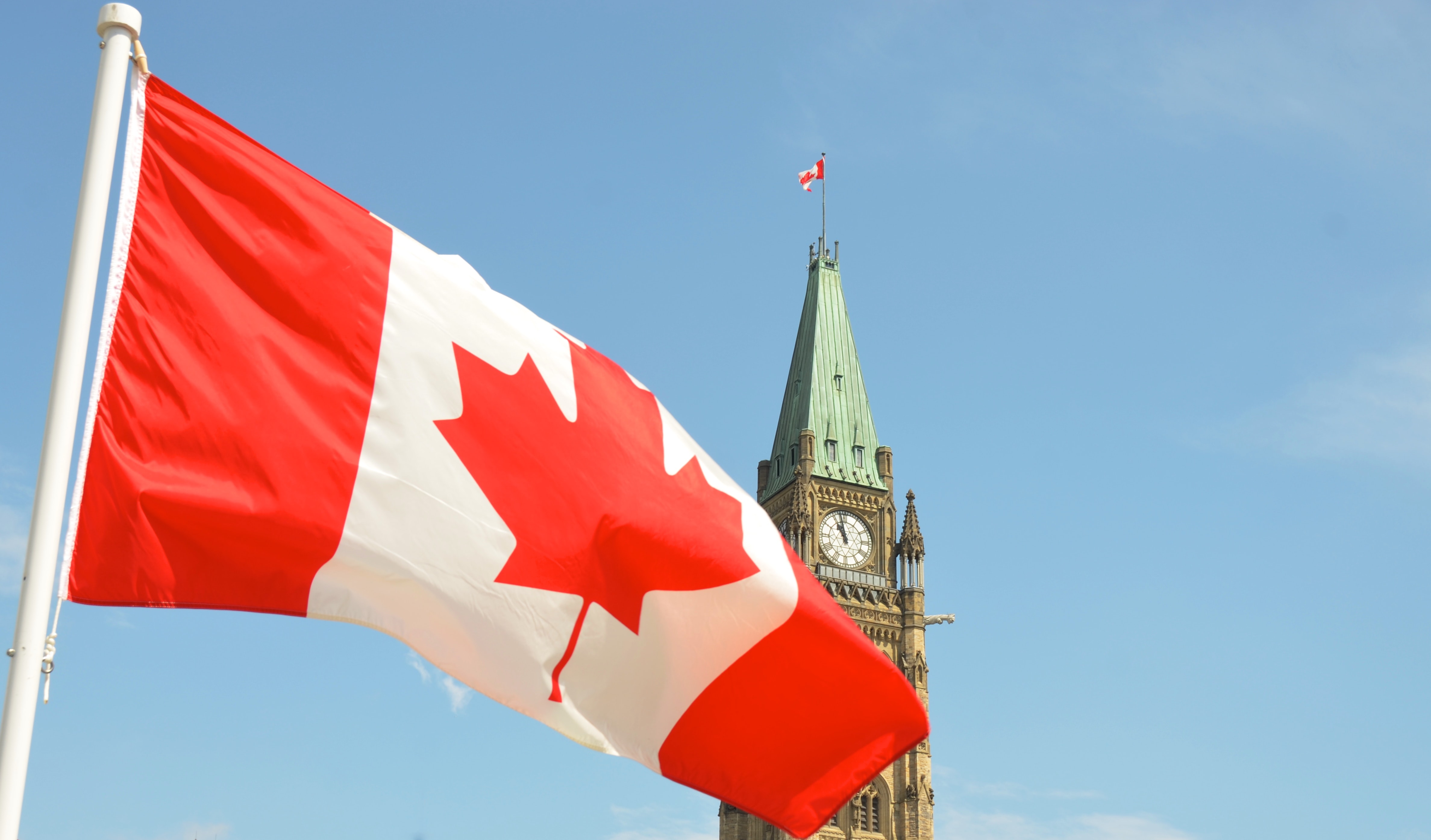 The Canadian flag flying at Parliament